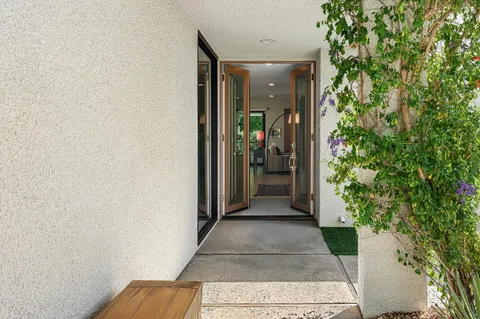 a living room with furniture and a table