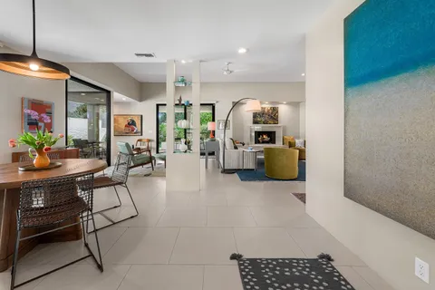 a living room with furniture flat screen tv and a fireplace