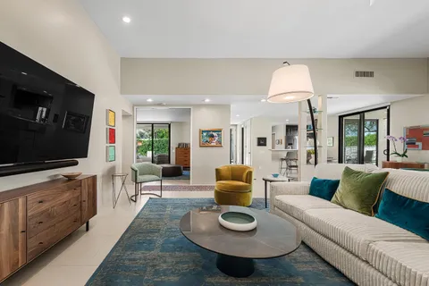 a living room with fireplace furniture and a fireplace