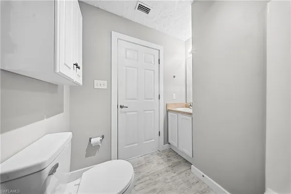 a bathroom with a toilet and a sink