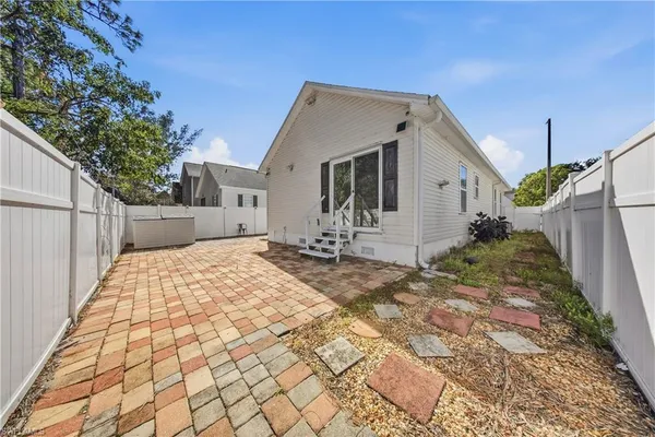 a backyard of a house with a yard and garage