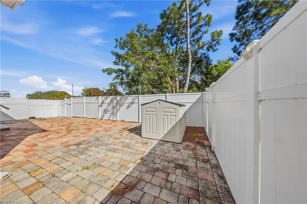 a very nice looking house with potted plants in front of it