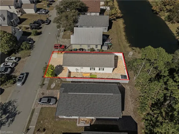 an aerial view of residential houses with outdoor space