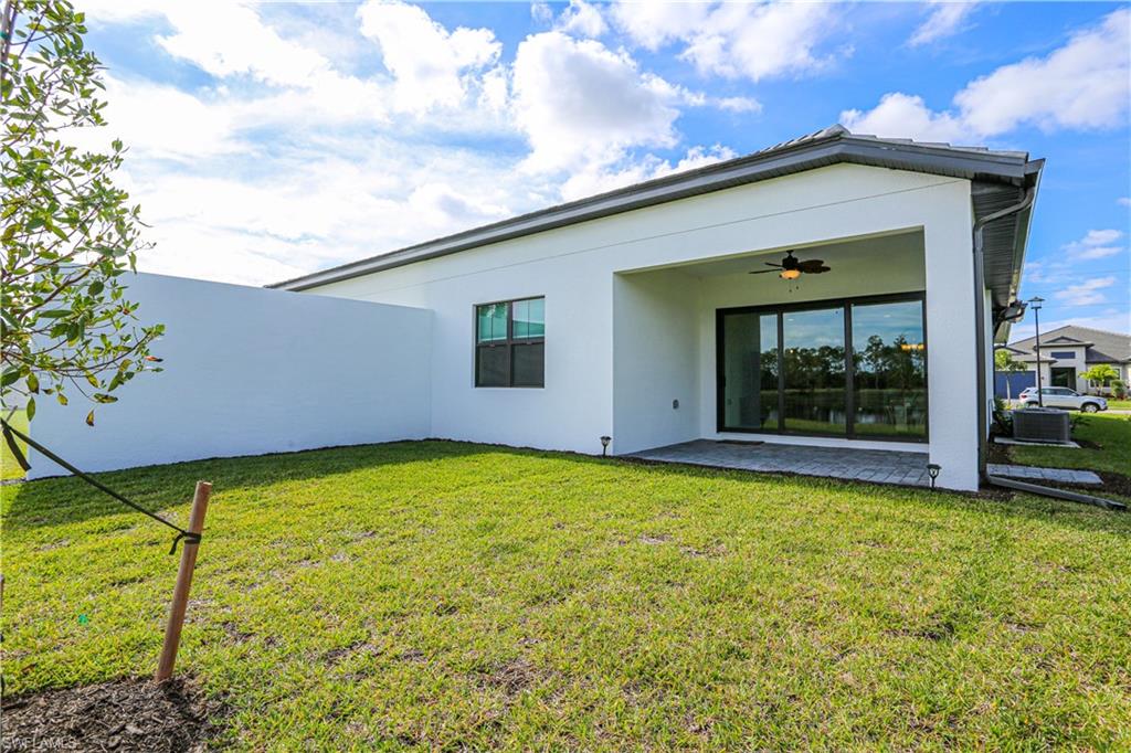 14759 Kingfisher Loop Naples, FL 34120 - Photo 35 of 35 a backyard of a house
