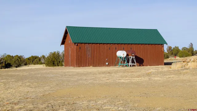 a view of a backyard of a house