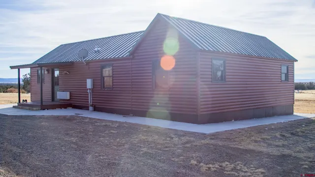 a view of a porch with wooden floor
