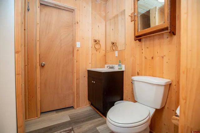 a view of a kitchen with stainless steel appliances granite countertop a dining table chairs and granite counter tops