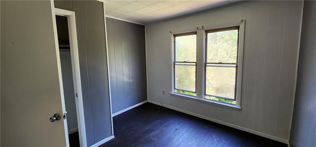 631 Reed Avenue Monessen, PA 15062 - Photo 11 of 12 an empty room with wooden floor and windows