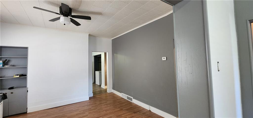 631 Reed Avenue Monessen, PA 15062 - Photo 6 of 12 a view of a hallway with wooden floor