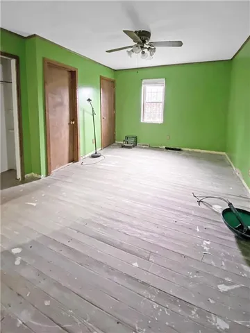 a view of a hallway with a window and a fireplace