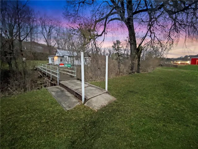 a view of a park with large trees