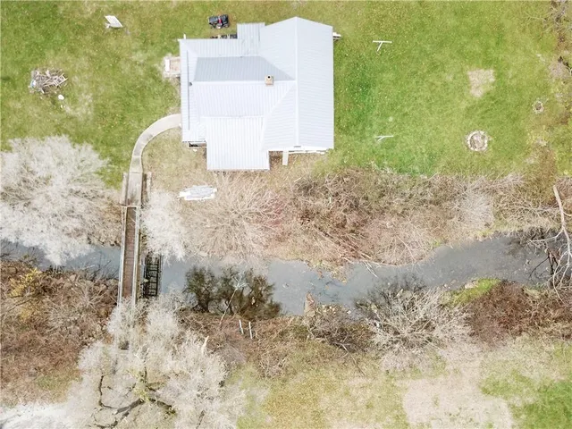 a aerial view of a house with a yard