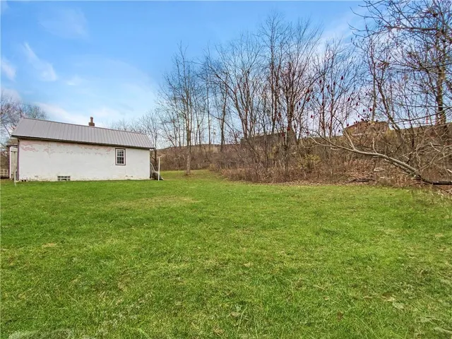 a view of a backyard of the house