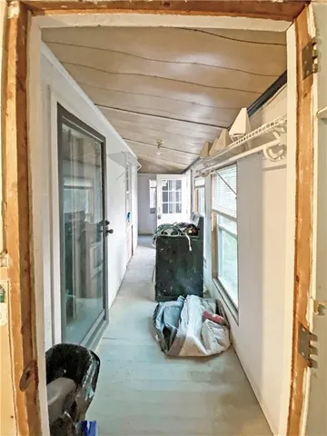 a room with lots of chairs and mirrors