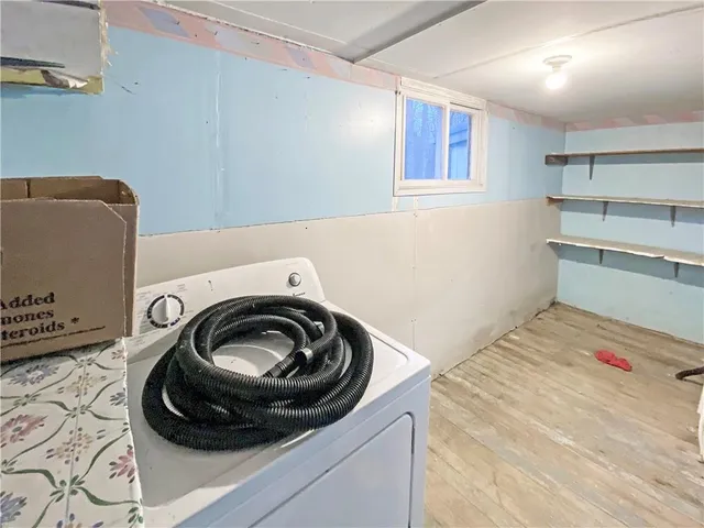 a utility room with sink dryer and washer