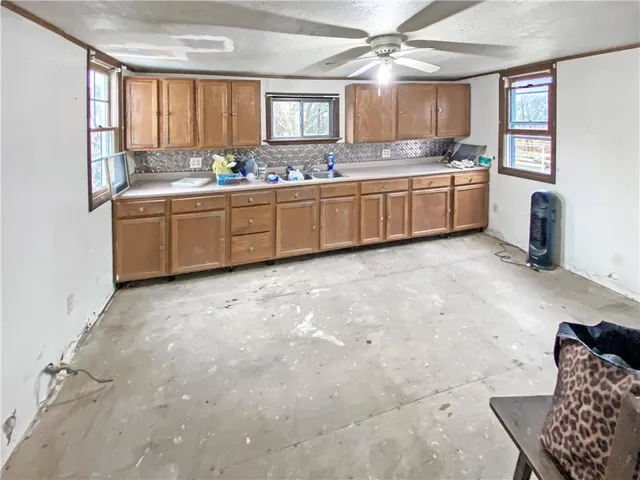 a kitchen with sink and window