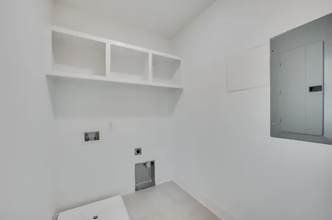 a living room with a bed furniture and a window