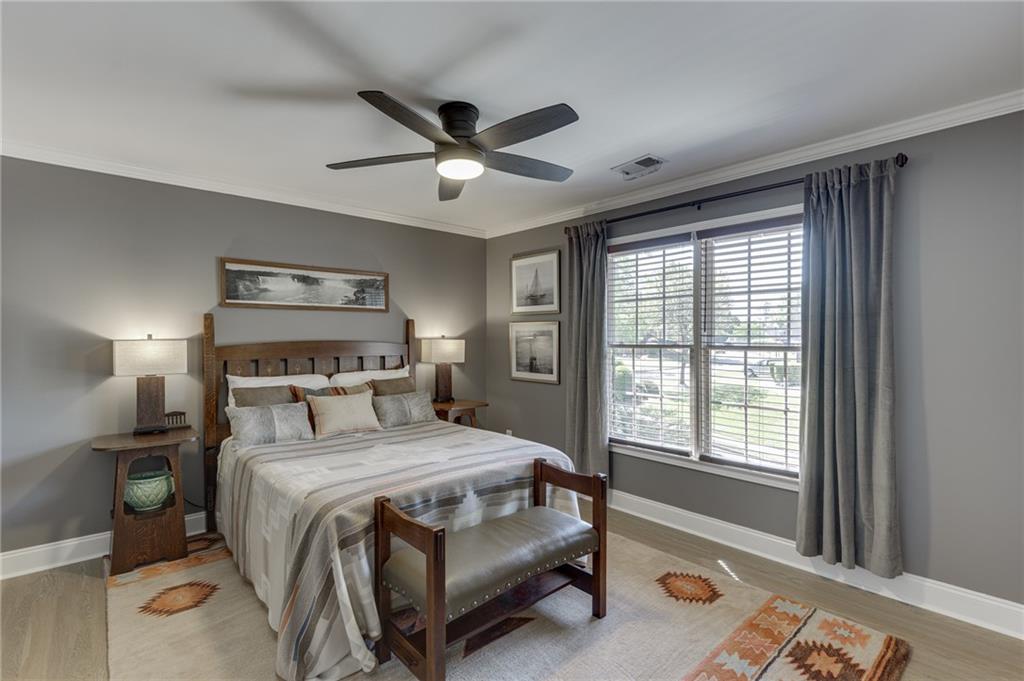 2758 Pathview Drive Dacula, GA 30019 - Photo 28 of 48 a bedroom with a large bed and a window