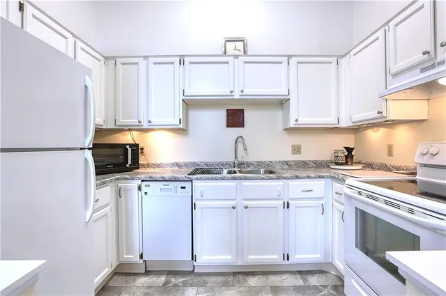 a view of a dining room with furniture and a window