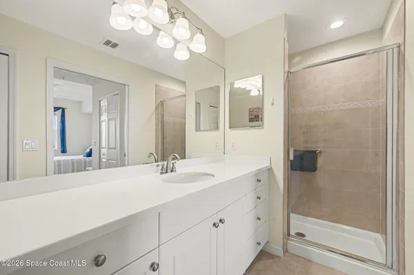 a view of a dining room with furniture and a book shelf