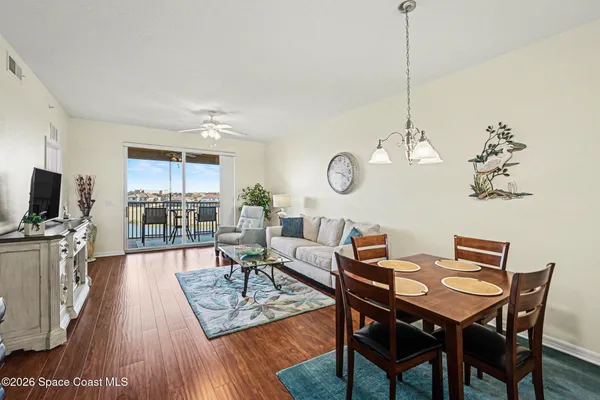 a room with pool table and windows