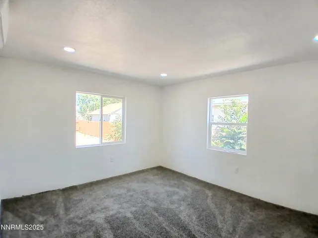 a bathroom with a toilet a sink and a mirror
