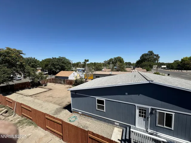 a house that has a tree in front of it