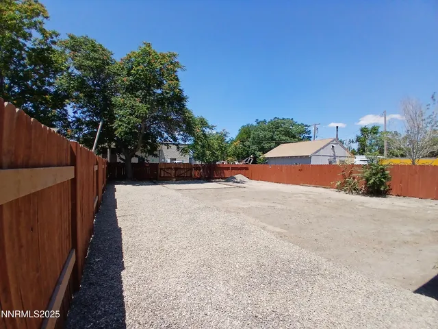 a room with pool table and a window