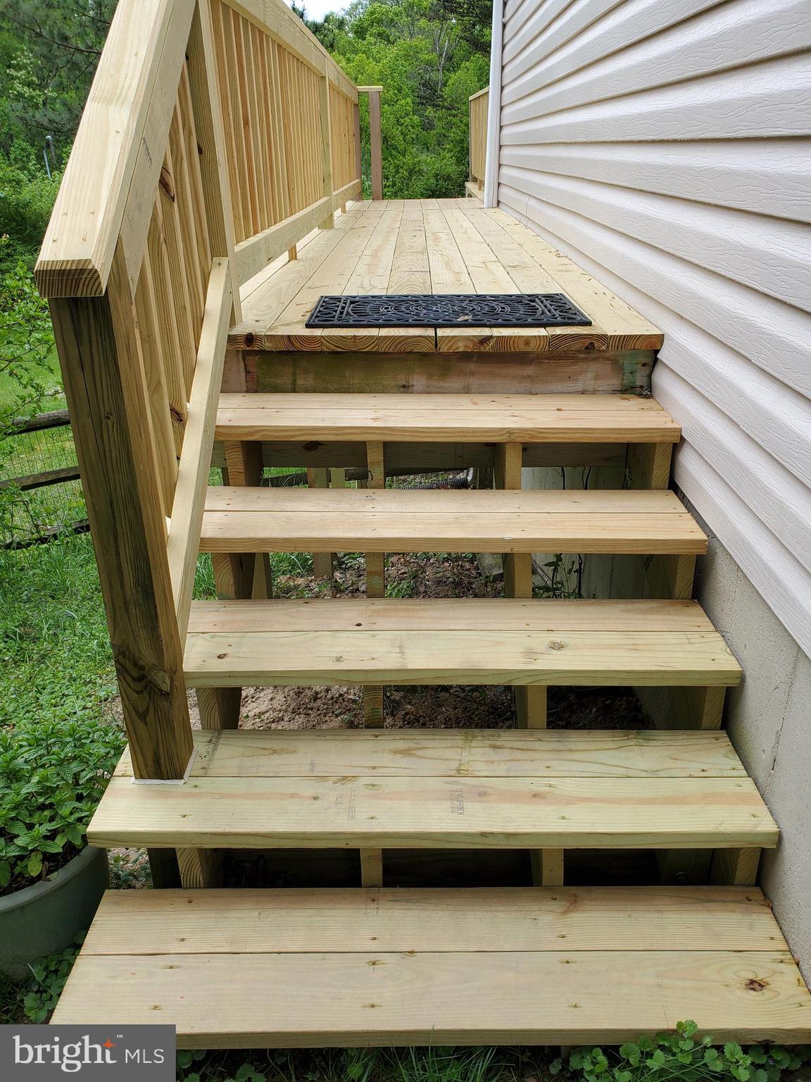 4549 Ambermill Road Baltimore, MD 21236 - Photo 9 of 46 Deck steps go from front to back yard
