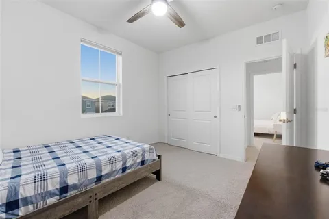 a bedroom with a bed and a view of bedroom
