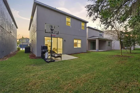 a view of a house with a backyard