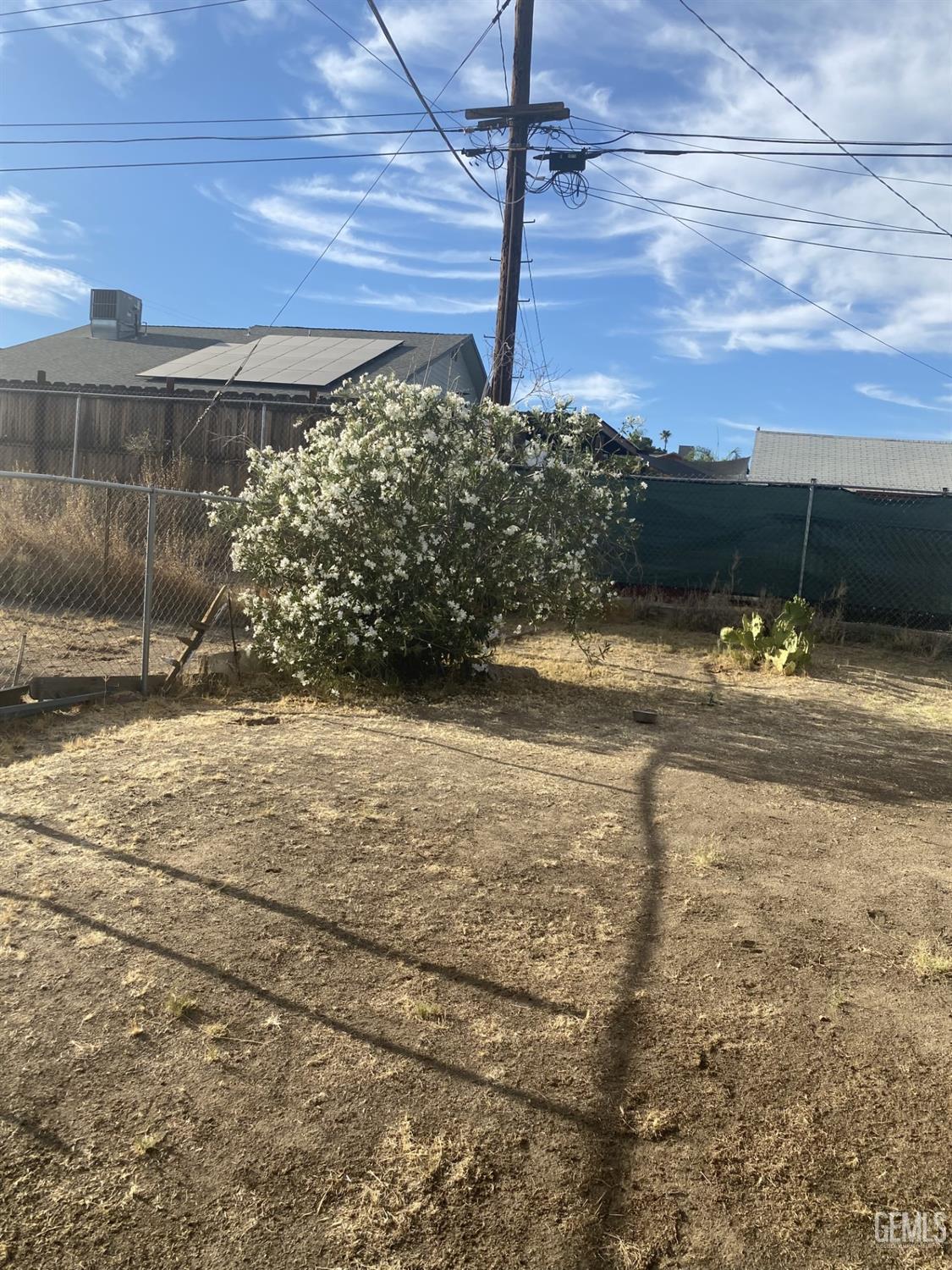 Undisclosed Address Bakersfield, CA 93306 - Photo 16 of 20 a view of a yard with a table and chair