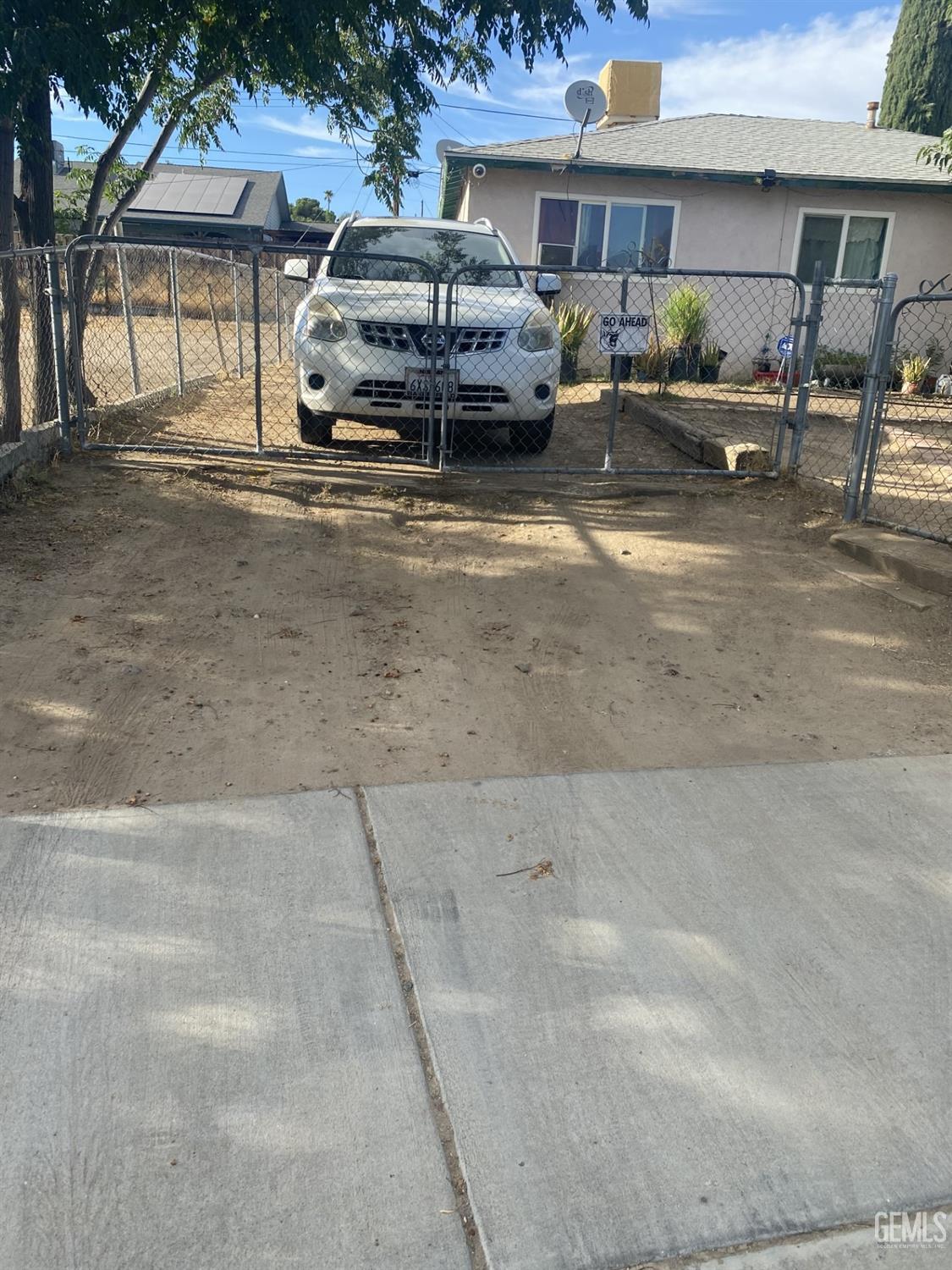 Undisclosed Address Bakersfield, CA 93306 - Photo 20 of 20 a car parked in front of a house