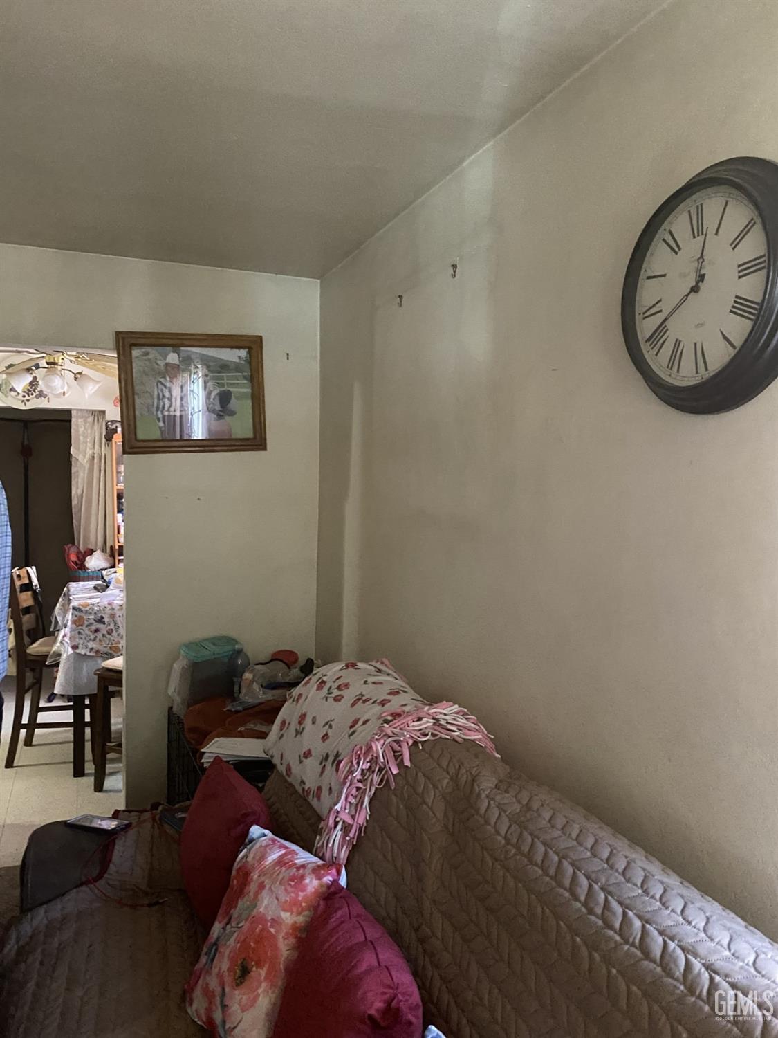 Undisclosed Address Bakersfield, CA 93306 - Photo 5 of 20 a bedroom with a bed and a chair in it