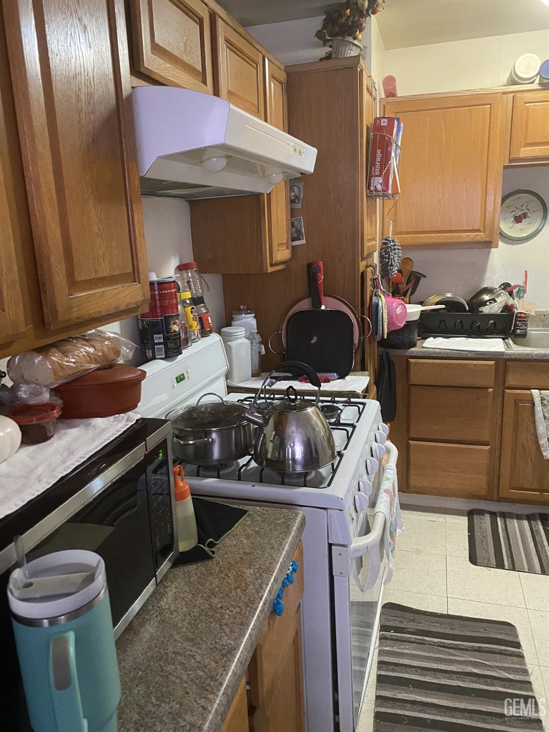 Undisclosed Address Bakersfield, CA 93306 - Photo 6 of 20 a kitchen with a stove and a sink