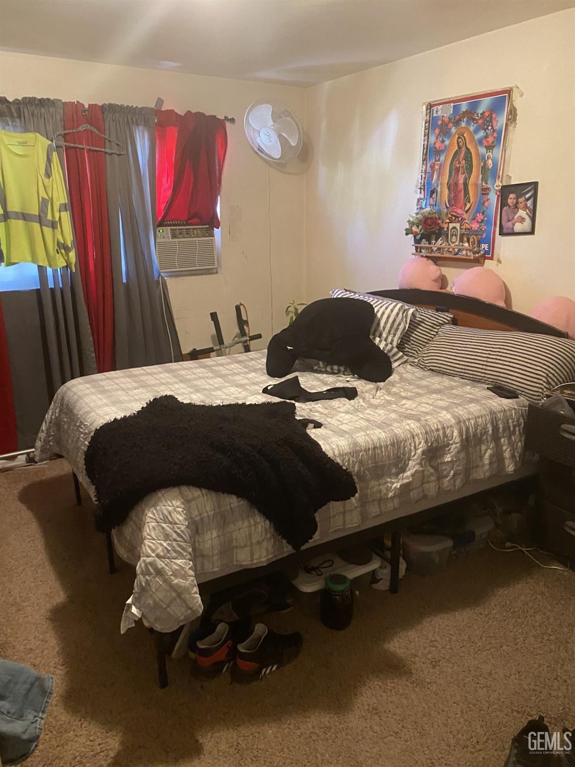 Undisclosed Address Bakersfield, CA 93306 - Photo 9 of 20 a bedroom with a bed and a painting on the wall