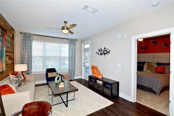 a living room with furniture and a flat screen tv