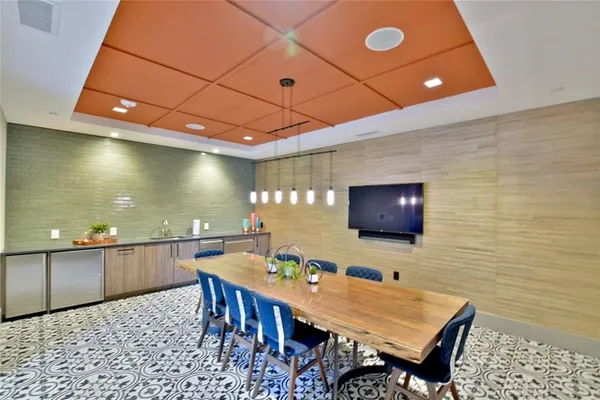 a dinning room with a table and chairs