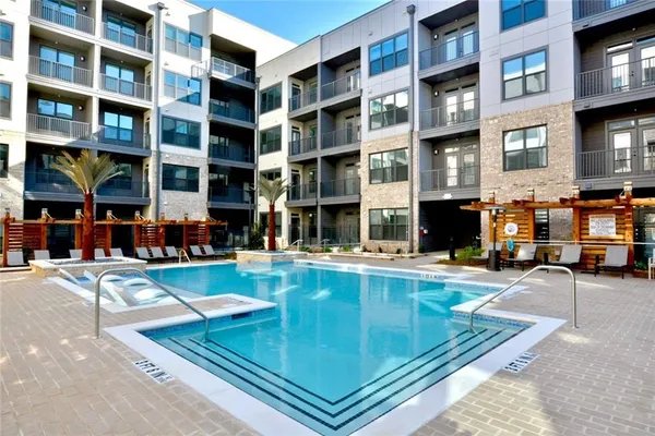 a view of pool with outdoor seating