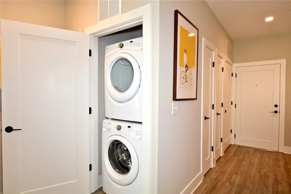 a view of a hallway with washer and dryer