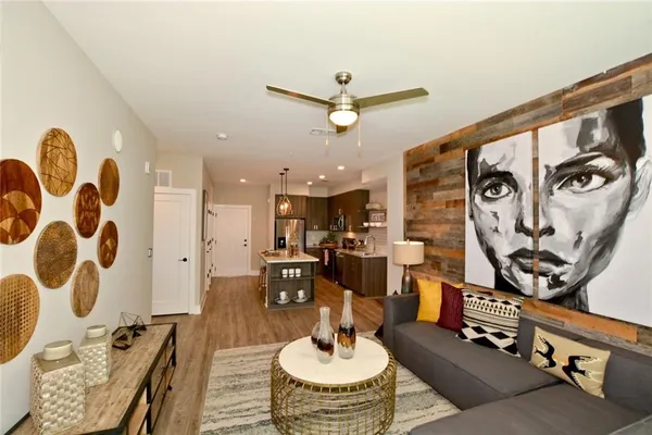 a living room with furniture and a rug