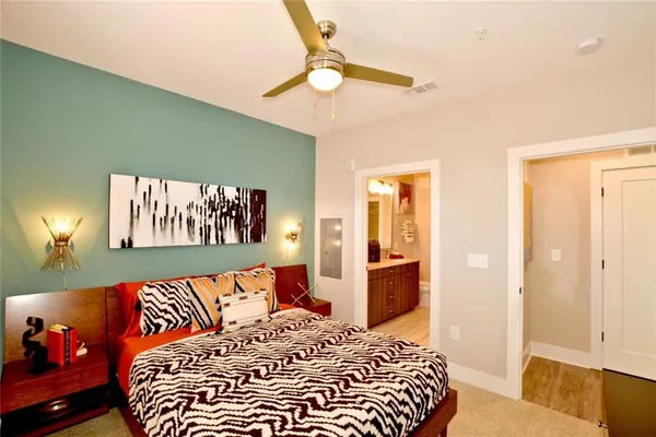 a bedroom with a bed and a dresser