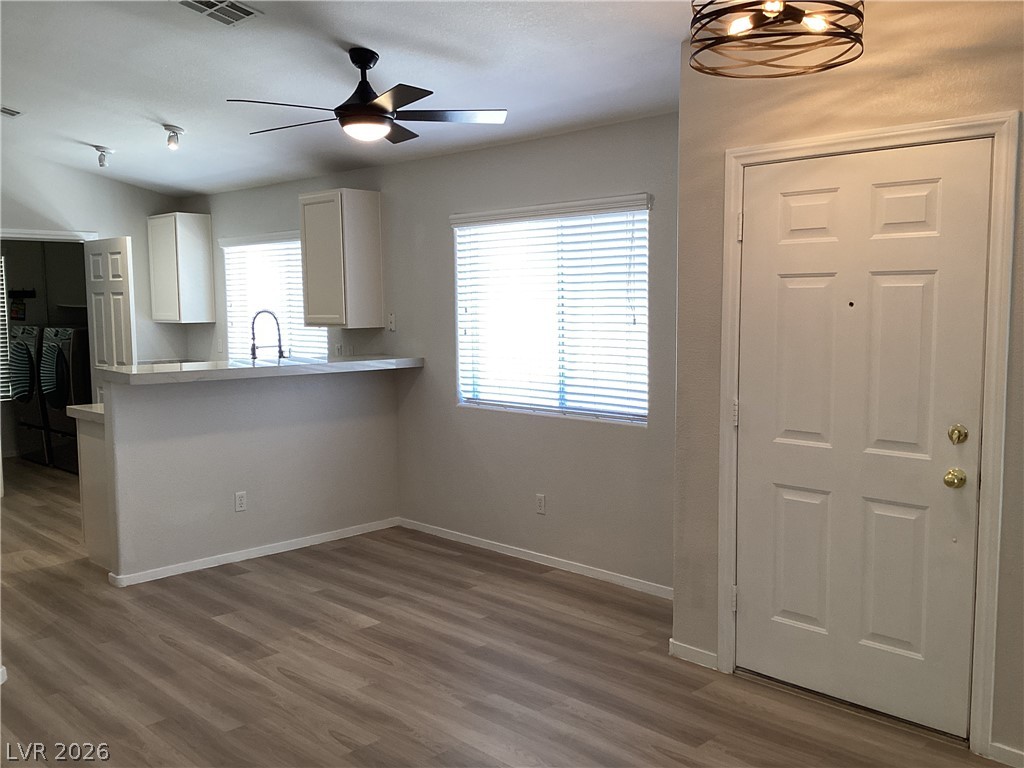 2135 Hidden Ranch Terrace Henderson, NV 89052 - Photo 7 of 27 Functional kitchen with sleek countertops and convenient bar seating, perfect for casual dining.