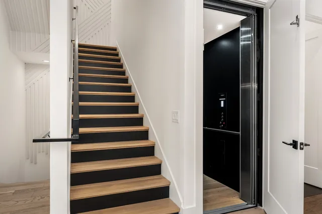 a view of entryway with wooden floor and windows