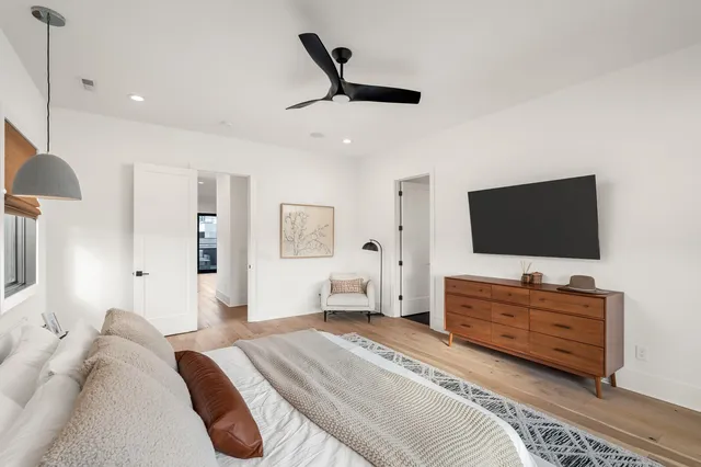 a bathroom with a double vanity sink mirror and bathtub