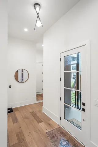 a view of a room with wooden floor and cabinet