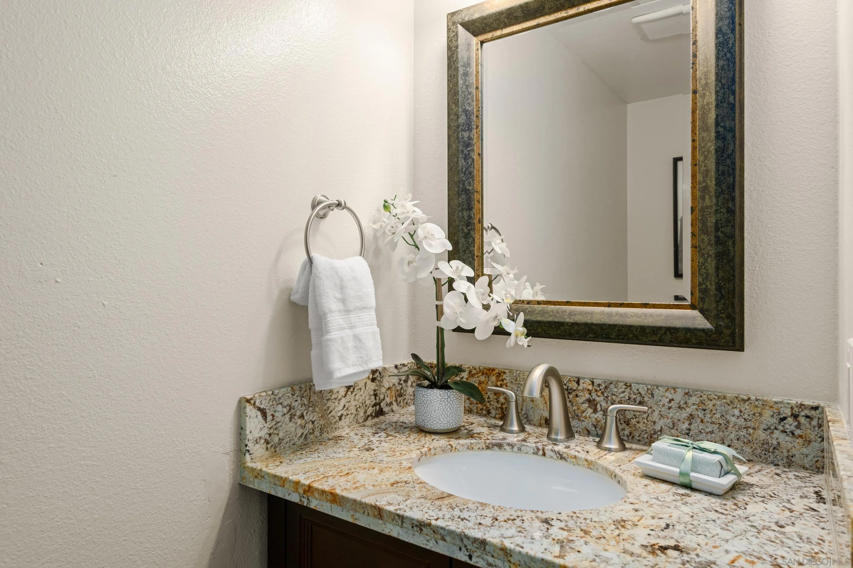 2002 Leafwood Place Encinitas, CA 92024 - Photo 19 of 64 a bathroom with a granite countertop sink and a mirror