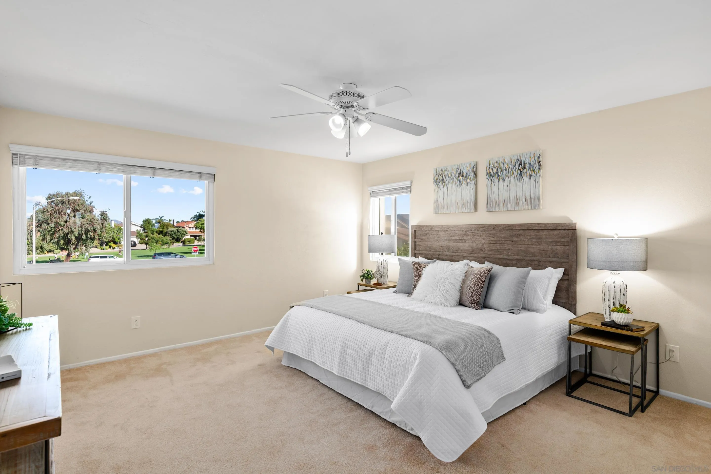 2002 Leafwood Place Encinitas, CA 92024 - Photo 20 of 64 a bedroom with a bed and a painting on the wall