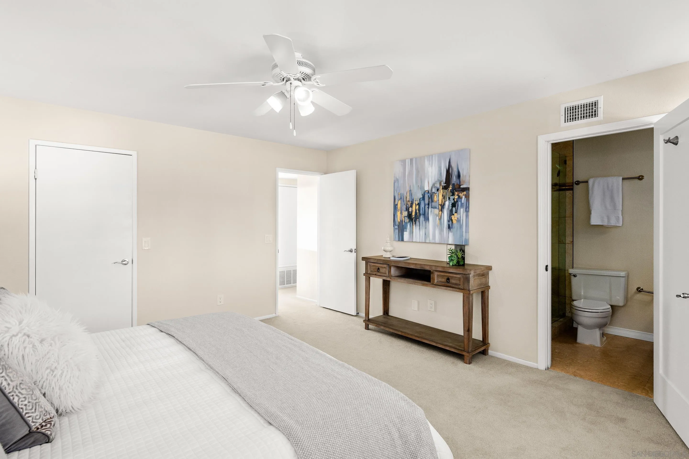 2002 Leafwood Place Encinitas, CA 92024 - Photo 22 of 64 a bedroom with a bed and ceiling fan