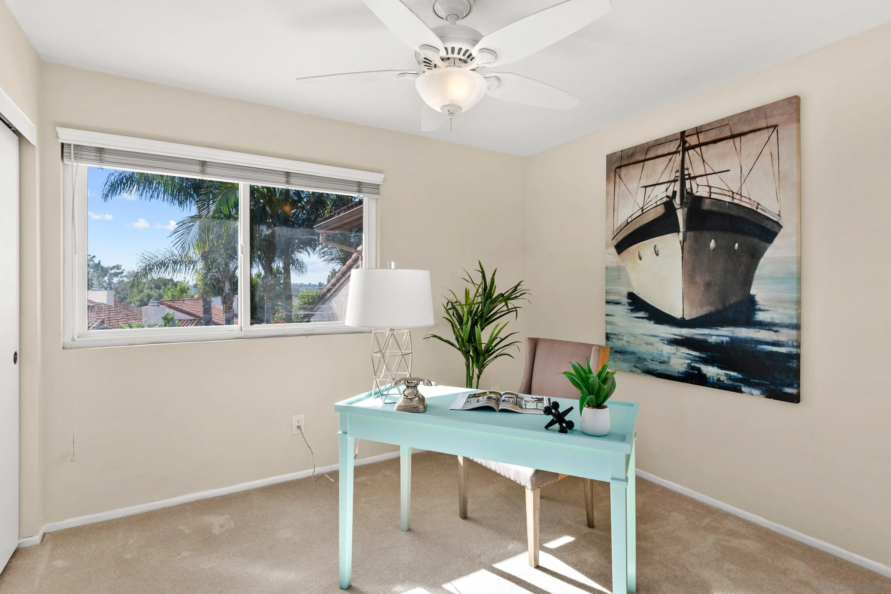 2002 Leafwood Place Encinitas, CA 92024 - Photo 26 of 64 a room with a window and a potted plant